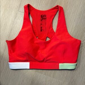 Free with any purchase! Red MPG Racerback Sports Bra with Colorblock Band